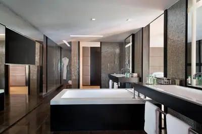 a bathroom with a large tub and a sink at JW Marriott Cannes in Cannes
