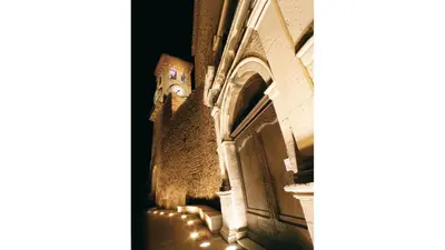a building with a clock on the side of it at Jonquille in Cannes