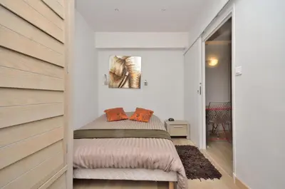 a bedroom with a bed in a room at One bedroom apartment Palais des festivals in Cannes