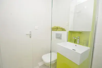 a bathroom with a toilet and a sink and a shower at One bedroom apartment Palais des festivals in Cannes