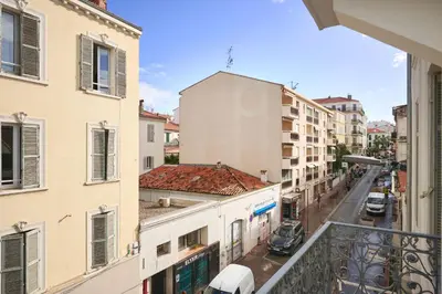 an apartment balcony with a view of a street at Hotel des Congrès et Festivals in Cannes