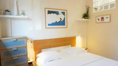 a bedroom with a bed and a picture on the wall at Proche Croisette, Studio Cosy by Palmazur in Cannes