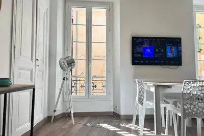 a room with a camera and a television on the wall at Charming 2-bedroom apartment with quality amenities in Old Cannes in Cannes