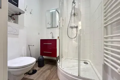 a bathroom with a toilet and a glass shower at Charming 2-bedroom apartment with quality amenities in Old Cannes in Cannes