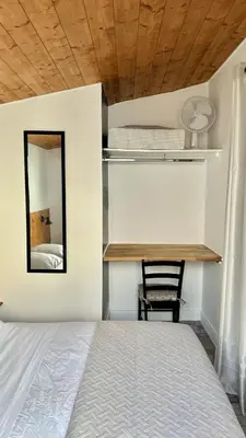 a bedroom with a bed and a mirror and a chair at Lion's Room - 2 minute walk from Palais des Festivals and Beaches in Cannes