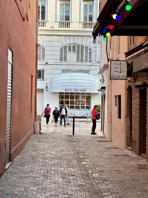 a group of people walking down a street at Lion's Room - 2 minute walk from Palais des Festivals and Beaches in Cannes
