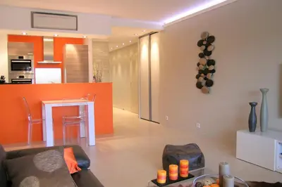 a living room with a couch and a table at Modern two bedroom apartment with two bathrooms, just behind the CARLTON in Cannes