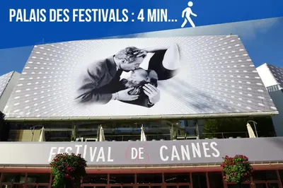 a billboard of a man kissing a baby on a building at Modern two bedroom apartment with two bathrooms, just behind the CARLTON in Cannes