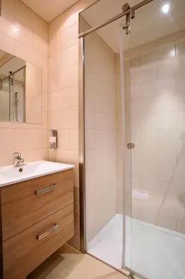 a bathroom with a shower and a sink at Modern two bedroom apartment with two bathrooms, just behind the CARLTON in Cannes