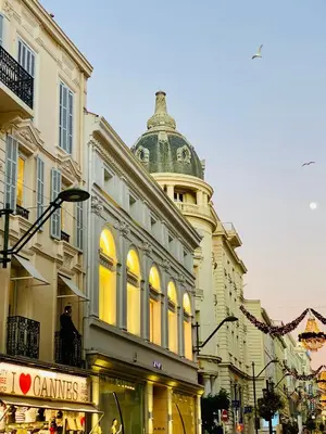 a building with a clock tower on top of it at Cozy 2 bedroom apartment in the centre of Cannes near the CROISETTE in Cannes