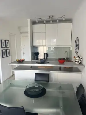 a kitchen with a table with a plate on it at Trianon Palace in Cannes