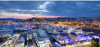 a group of boats docked in a marina at night at Cosy 1BR Cannes Gambetta hyper centre - Croisette 1 mn - 4 pers by Olam Properties in Cannes