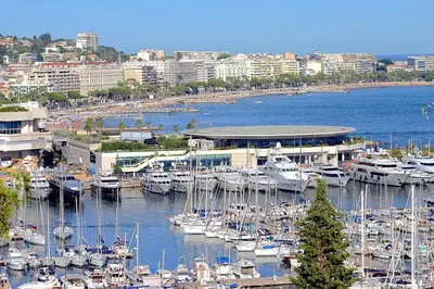 a group of boats docked at a marina in a city at Cannes Close Centre 2 BR 2 bath mezzanine & balconies Exceptional Rating Ideal Families Easy parking by Olam Properties in Cannes