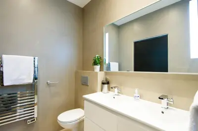a bathroom with a sink and a toilet and a mirror at Heart of Cannes Amazing design apartment Croisette Top Location Best Seller by OIam Properties in Cannes