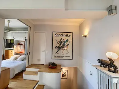a bedroom with a bed and a poster on the wall at FRGK 
