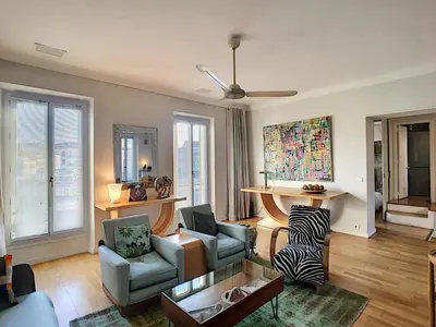 a living room with a couch and chairs and a table at FRGK 