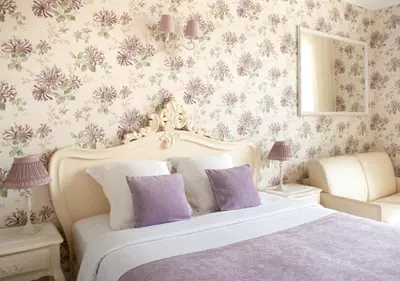 a bedroom with a bed and a table with a breakfast at Croisette Palais Miramar Cannes Imperial in Cannes