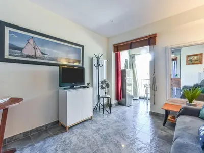 a living room with a tv and a couch at Apartment La Brise by Interhome in Cannes