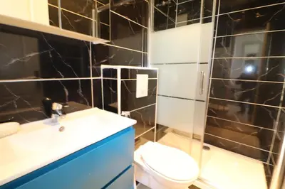 a bathroom with a toilet and a sink and a shower at Carré d'Or 1 bedroom 2 mins from Croisette 5 from Palais 243 in Cannes