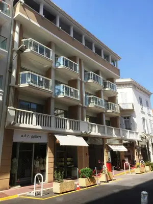 an apartment building on the corner of a street at Villa d'Estelle in Cannes
