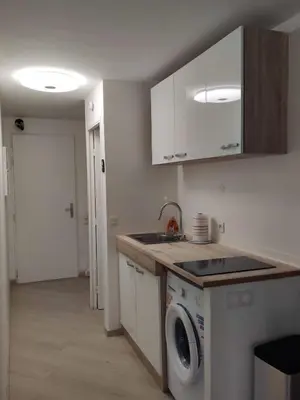 a kitchen with a sink and a washing machine at L'Estérel in Cannes