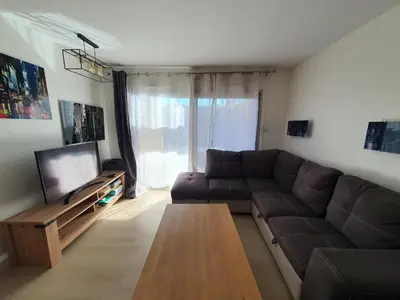 a living room with a couch and a coffee table at L'Estérel in Cannes
