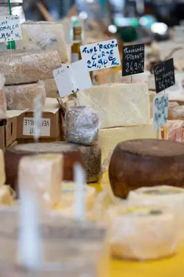 a display of different types of cheese on a table at Near Croisette- 4 Star Studio -SeaView in Cannes