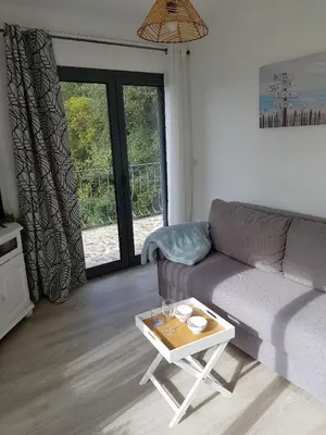 a living room with a couch and a coffee table at A little Eden in Le Cannet