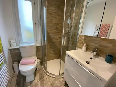 a bathroom with a toilet and a shower and a sink at Studio and gallery in Cannes