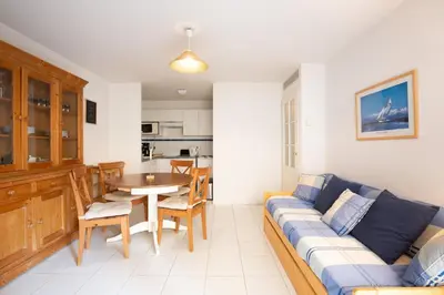 a living room with a couch and a table at Palazzio Vieux Port by Welcome to Cannes in Cannes