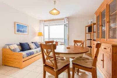 a living room with a table and a couch at Palazzio Vieux Port by Welcome to Cannes in Cannes