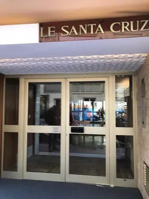 an entrance to a building with glass doors at Magnifique 2 pièces Palm Beach bord mer in Cannes