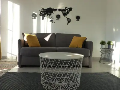 a living room with a couch and a coffee table at LE 31 in Cannes