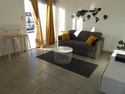 a living room with a couch and a table at LE 31 in Cannes