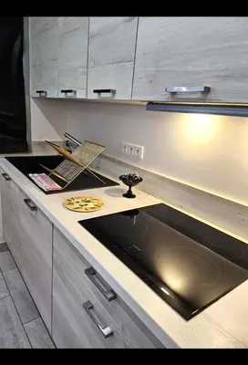 a kitchen with a counter top with a sink at La vue d'Azur, élégance et lumière à Cannes in Cannes