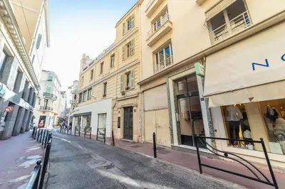 an empty street in a city with buildings at Luxury Apartment - 150m to Palais des Festivals ( Cannes ) in Cannes