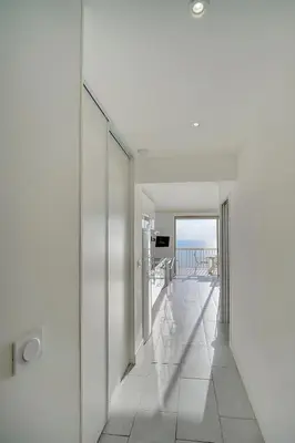 a hallway of a house with a view of the ocean at IMMOGROOM - Panoramic View - quiet - AC - bright in Cannes