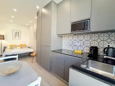 a kitchen with a sink and a counter top at Brand-New 1 Bedroom Fully Refurbished in Cannes