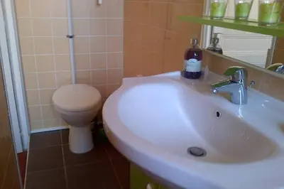 a bathroom with a white sink and a toilet at CANNES in Cannes