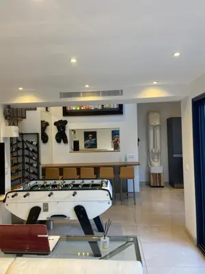 a room with a table and a boat in it at VILLA OCEANE in Cannes