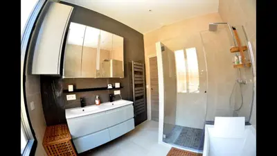 a bathroom with a white sink and a shower at VILLA OCEANE in Cannes