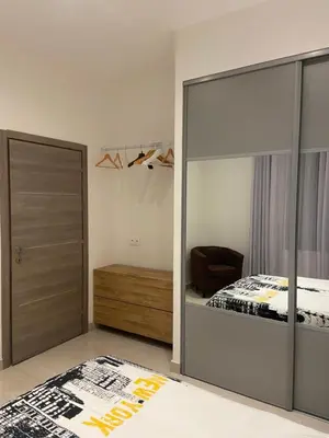 a bedroom with a bed and a sliding glass door at VILLA OCEANE in Cannes
