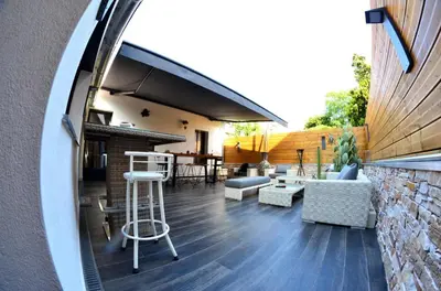 an external view of a patio with chairs and tables at VILLA OCEANE in Cannes