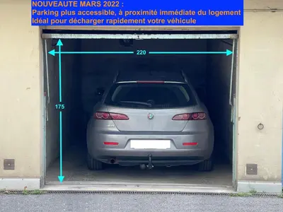 a car is parked inside of a garage at Cosy apartment + secured PARKING in Cannes