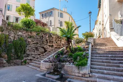 a set of stairs in front of some buildings at Studio Léa in Cannes