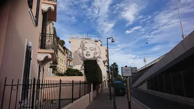 a mural of a woman on the side of a building at Nicolas 8 in Cannes