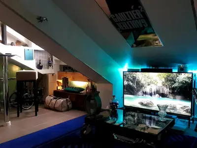a living room with a large flat screen tv at CANNES TOIT ET MOI in Cannes