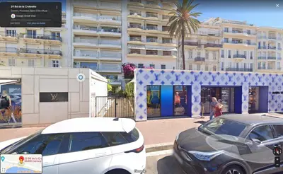 two cars parked in a parking lot in front of a building at Lovely 1 Bedroom Boulevard de la Croisette in Cannes