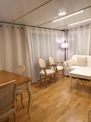 a living room with a couch and a table and chairs at Lovely 1 Bedroom Boulevard de la Croisette in Cannes