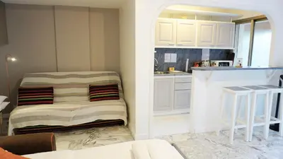 a small kitchen with white cabinets and a counter at Proche Croisette, Exclusivité Congres by Palmazur in Cannes